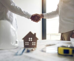 partnership engineering man with construction worker greeting shaking hand a foreman